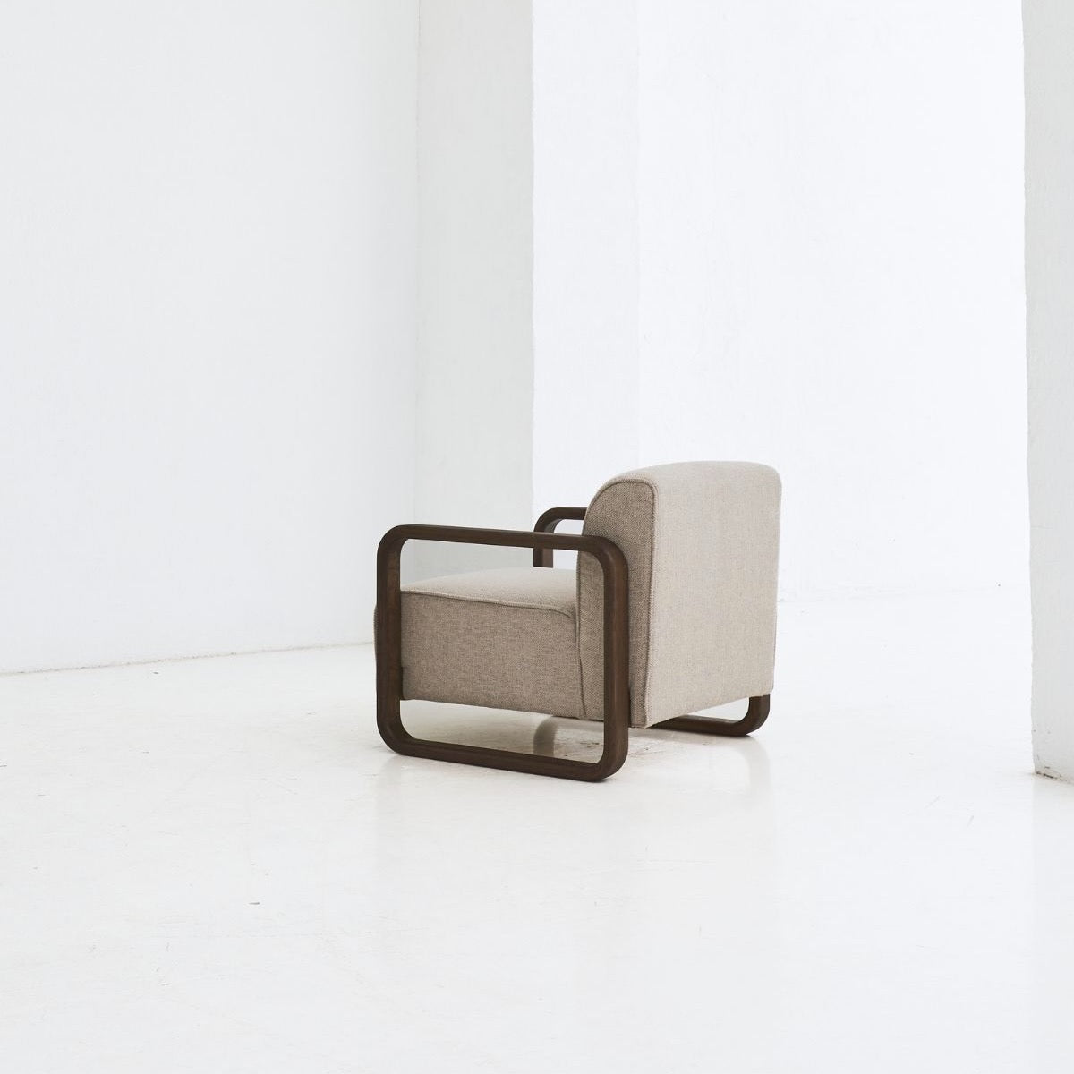 REDYK wooden armchair with rounded shape and artisan detail