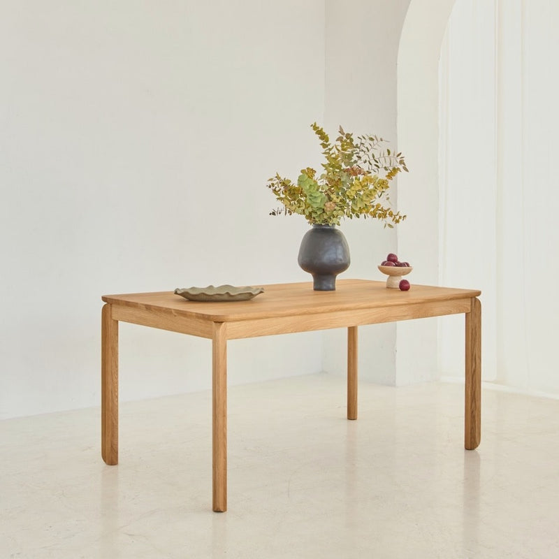 Side view of handcrafted extendable BENO table showing refined oak details