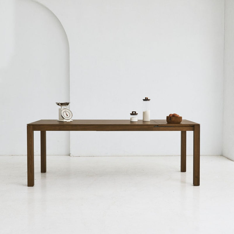 Side view of BRAN table highlighting slim profile and solid oak craftsmanship