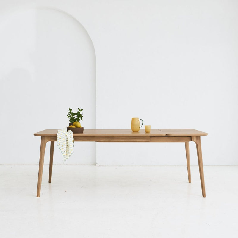 Extendable version of DUNO dining table made entirely from solid oak wood