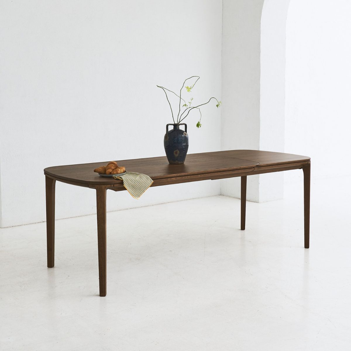 Organic-shaped solid oak dining table SEVA – perfect for modern interiors
