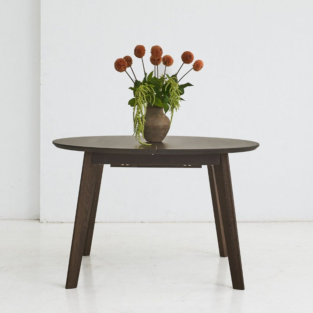OLMA round solid oak dining table with handcrafted finish and extendable design