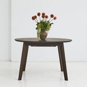 OLMA round solid oak dining table with handcrafted finish and extendable design