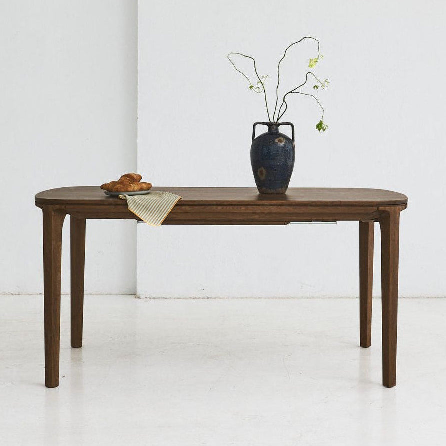 SEVA solid oak dining table with rounded shapes and flowing lines