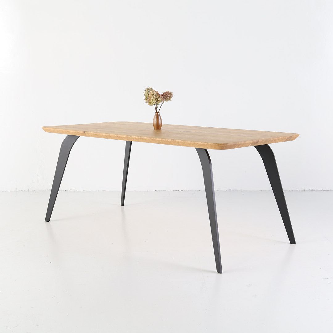 ST 2 oak table featuring smooth rounded corners and elegant finish