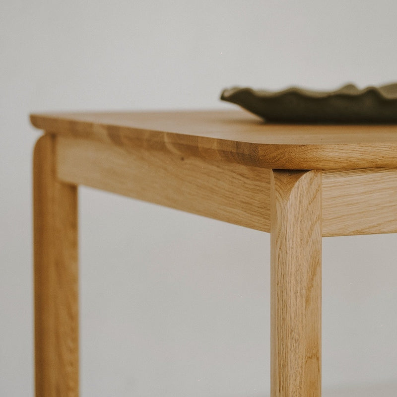 Close-up of solid oak tabletop showing natural grain and smooth finish
