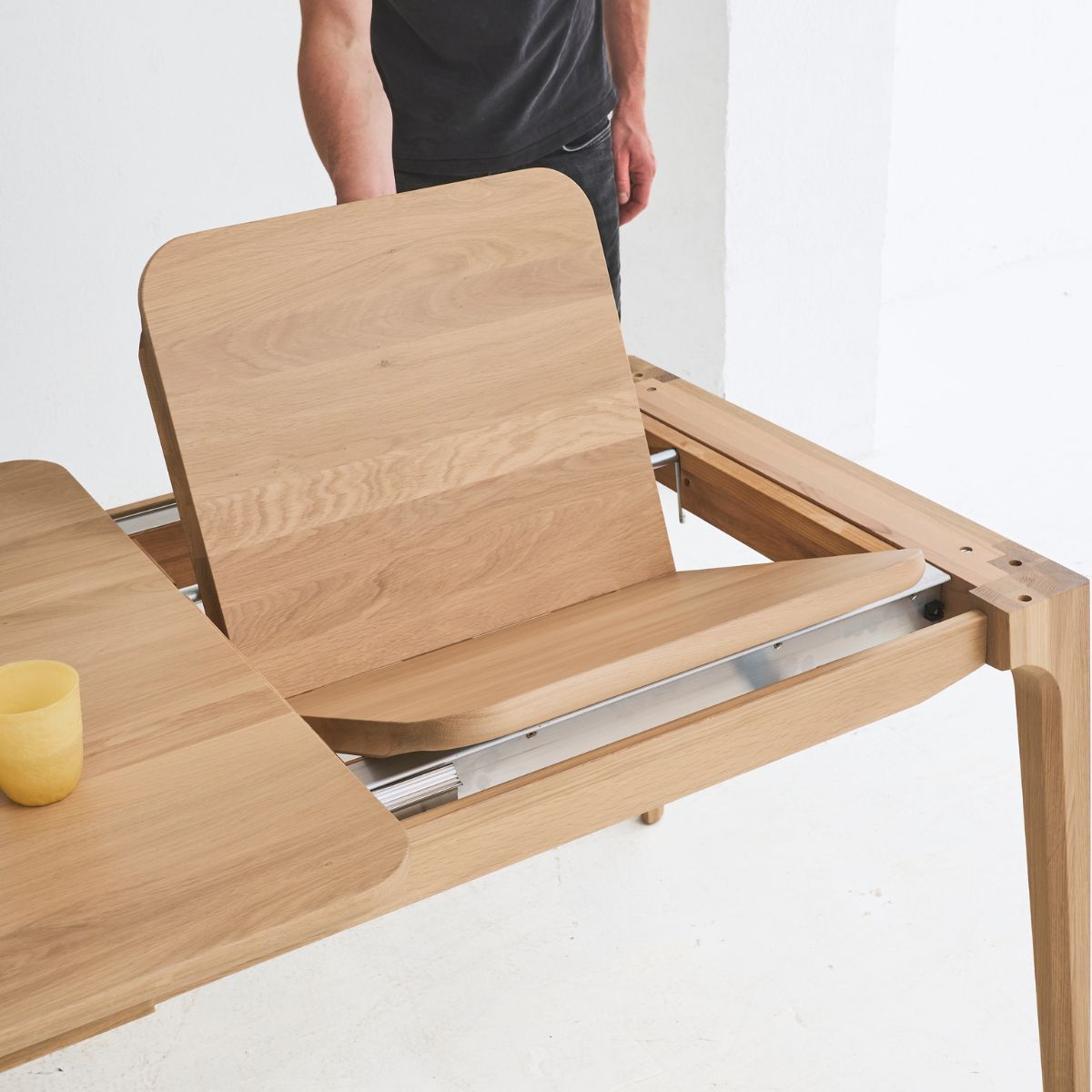 Elegant solid oak table combining Japanese simplicity and European craftsmanship