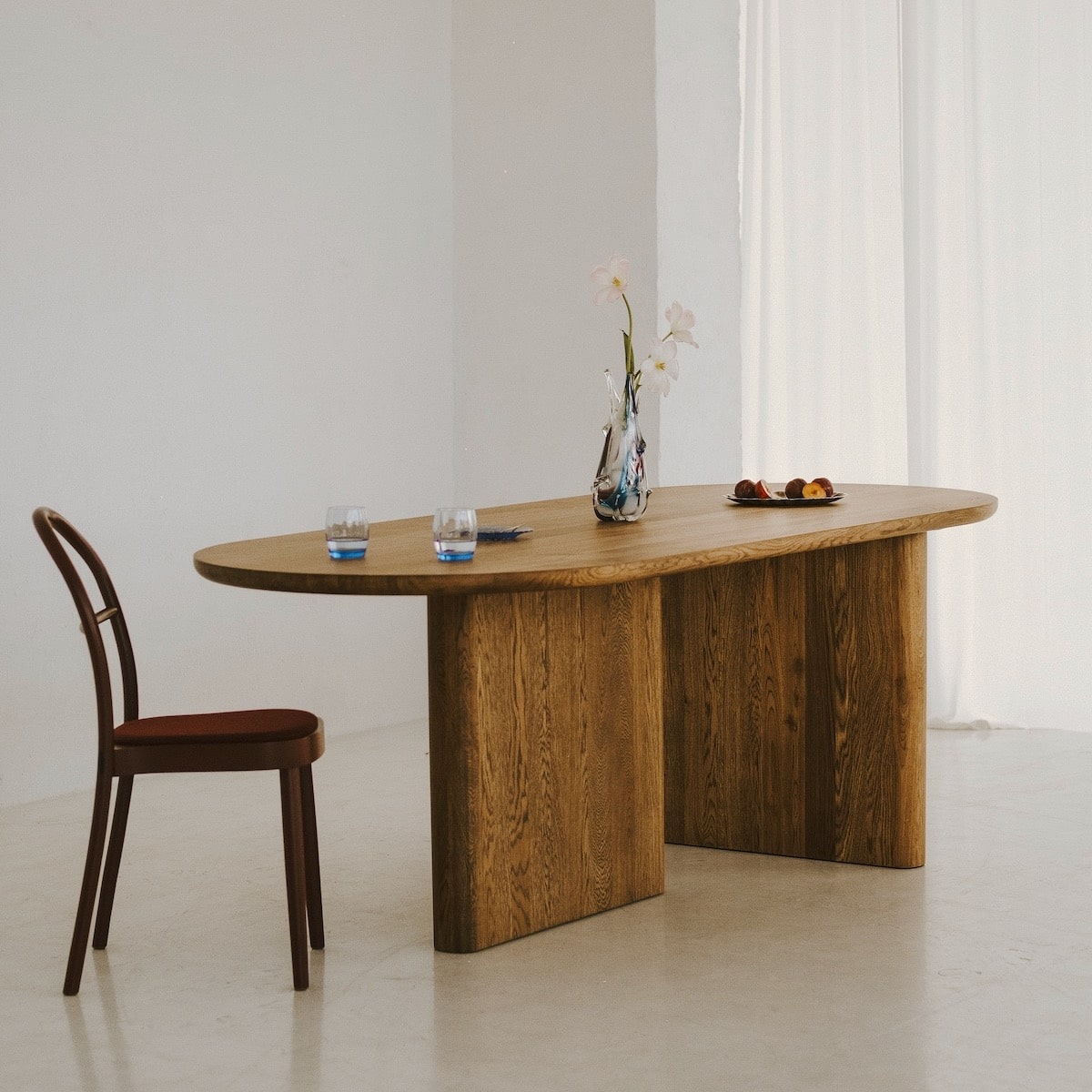 Close-up of KAZA dining table showing natural oak grain