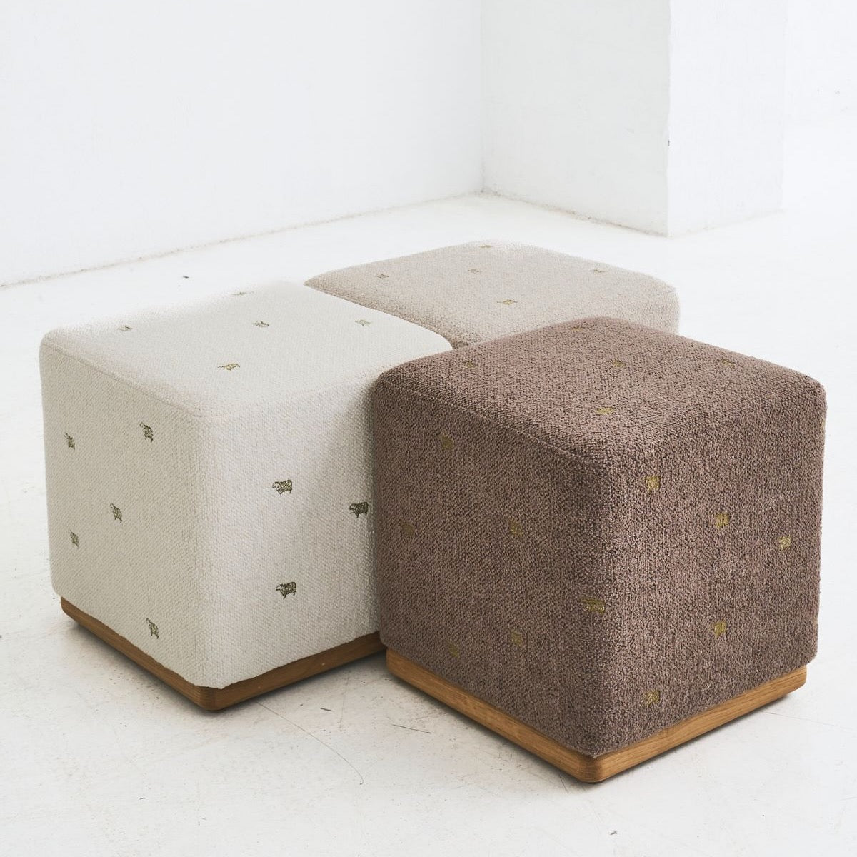 Handcrafted REDYK pouf made from solid oak and soft textile