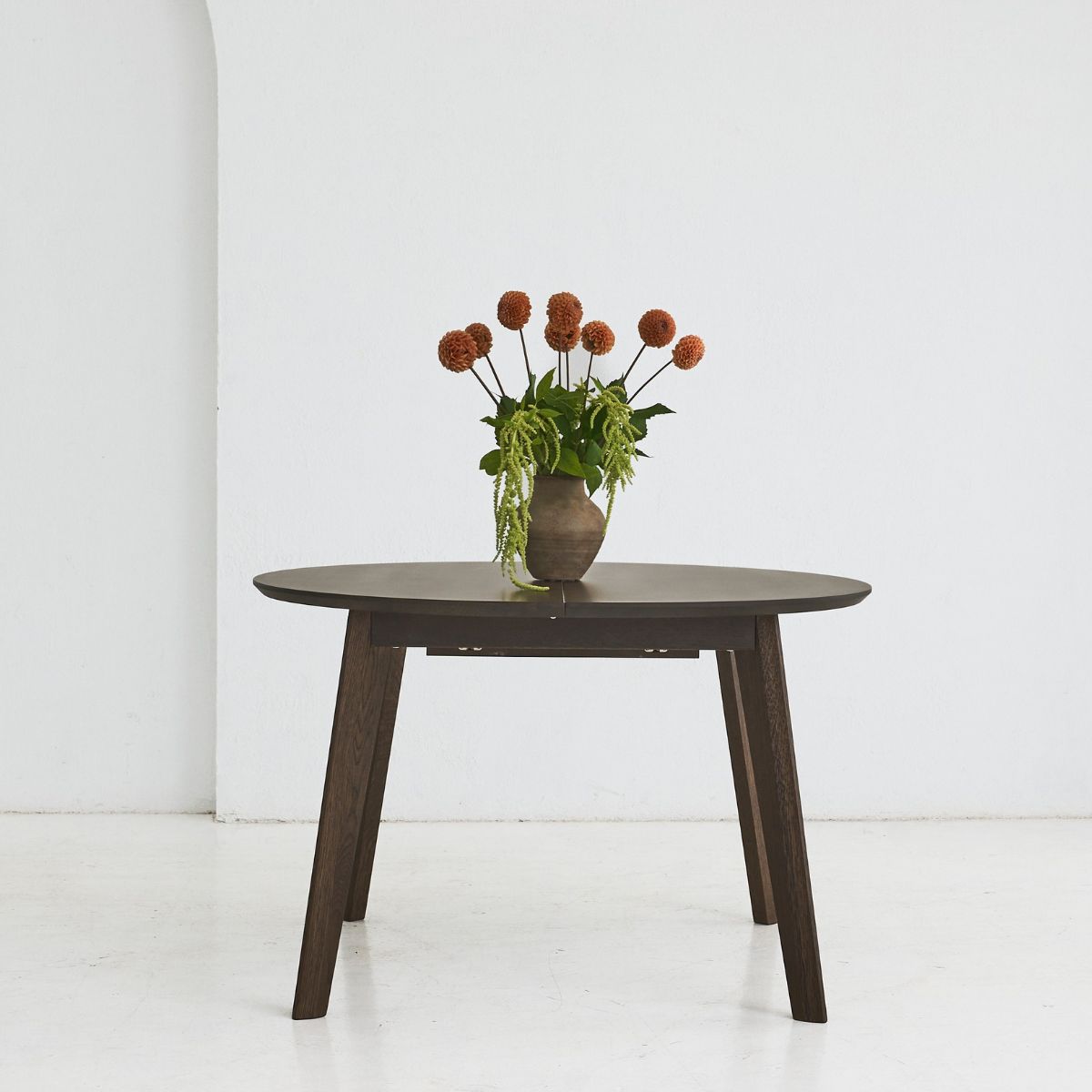OLMA round solid oak dining table with handcrafted finish and extendable design