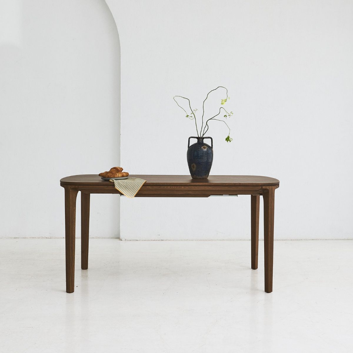 SEVA solid oak dining table with rounded shapes and flowing lines