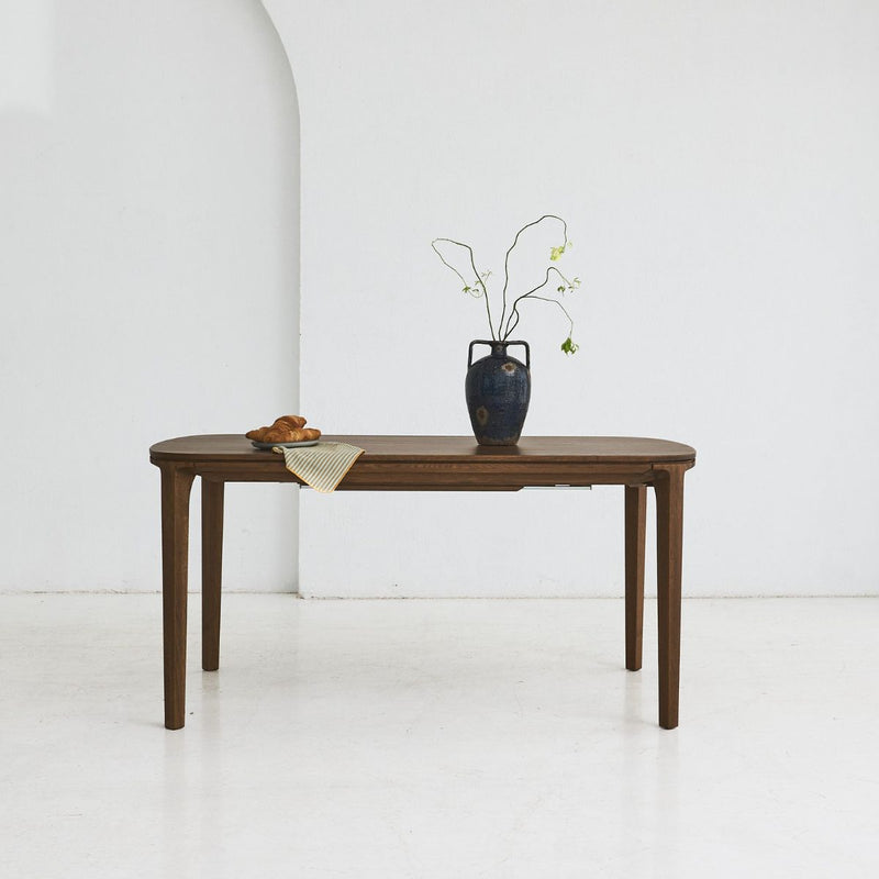 SEVA solid oak dining table with rounded shapes and flowing lines