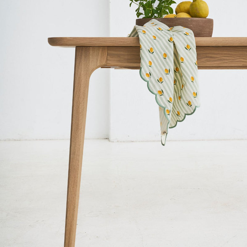 Fixed DUNO oak dining table with pure lines and handcrafted detailing