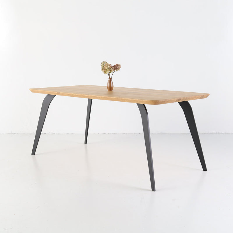 ST 2 oak table featuring smooth rounded corners and elegant finish